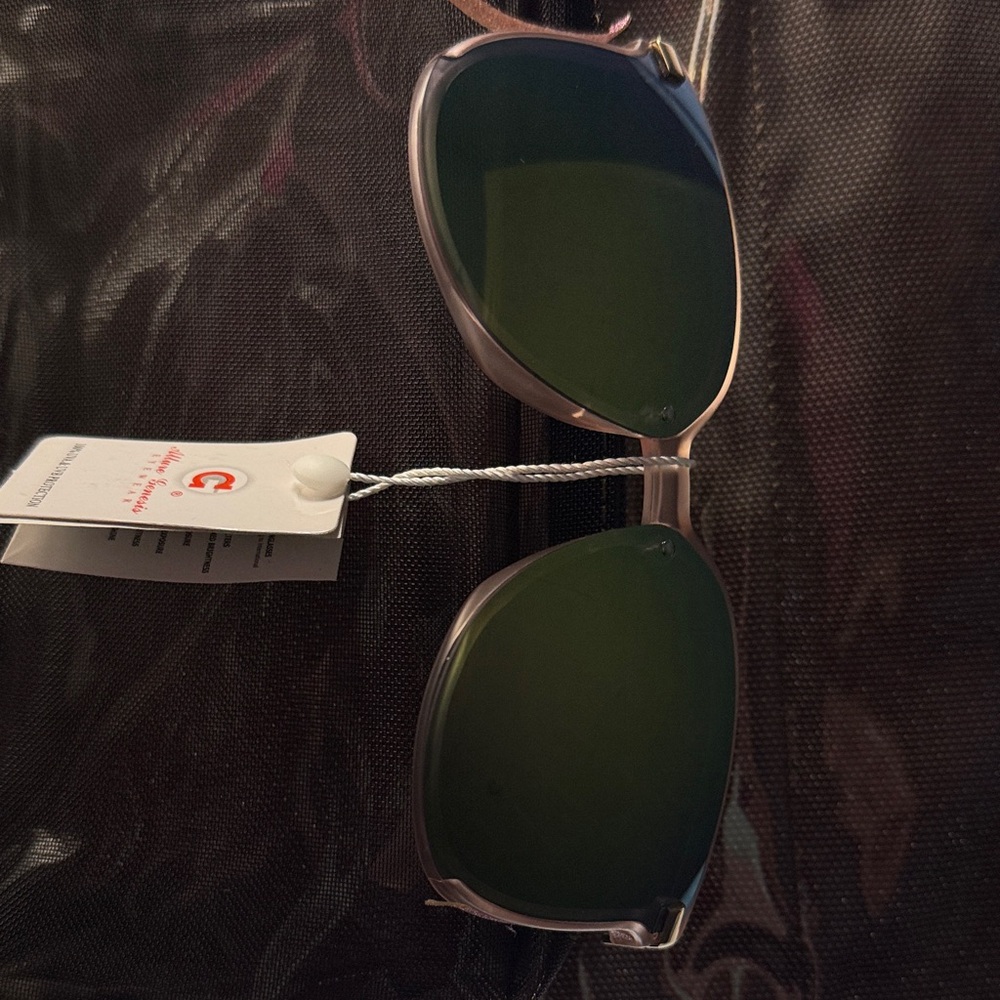 Sunglasses.  Brand new with tags. Too large for my face
